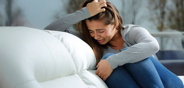 young woman experiencing great emotional pain after a breakup