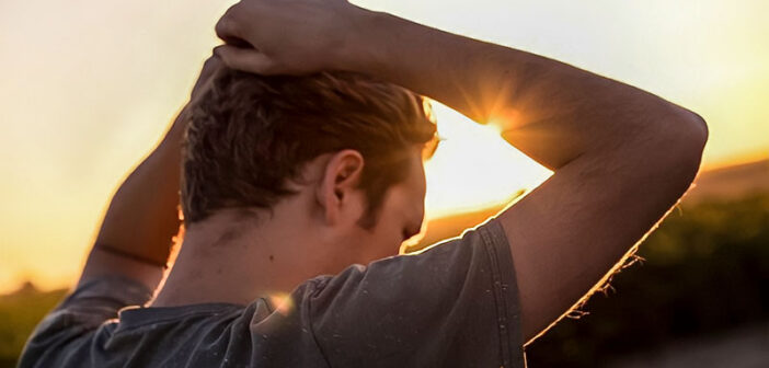 emotionally unavailable man with hands on his head