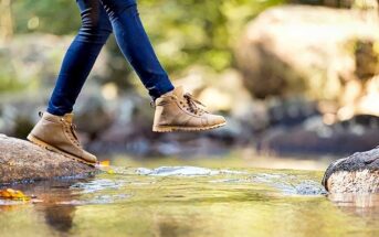 woman jumping over stream illustrating being proactive