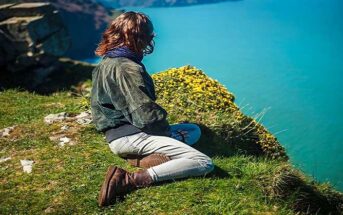 woman on clifftop thinking about her priorities in life