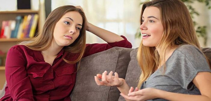 woman talking about herself non-stop while friend looks bored - illustrating the concept of conversational narcissism