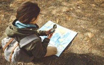 woman with map and compass illustrating the idea of trusting yourself