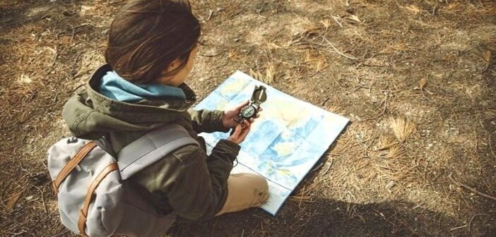 woman with map and compass illustrating the idea of trusting yourself