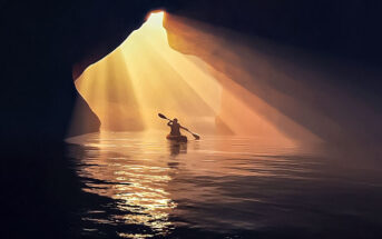 person in canoe inside cave - doing some soul searching