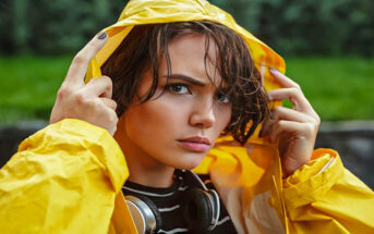 young unhappy woman in bright yellow coat to illustrate sucking at life