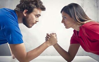 man and woman having arm wrestle because they always need to be right