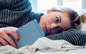 girl who has been ghosted looking at phone