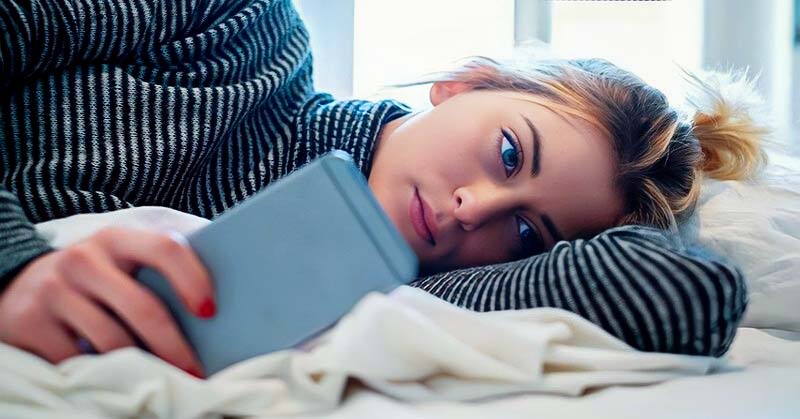 girl who has been ghosted looking at phone