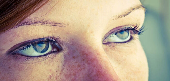 closeup of woman's eyes look bored with no passion