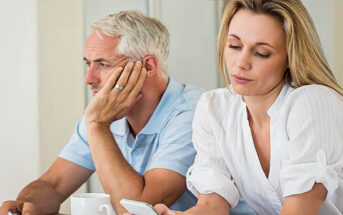 middle aged couple appearing distant to one another - illustrating loneliness in a marriage