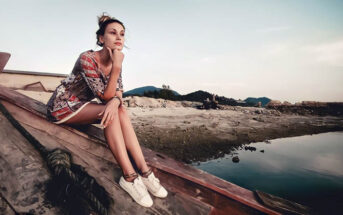 young woman sitting on shipwrecked boat feeling stuck in her life