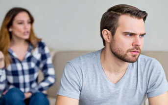 man and woman looking resentful toward each other
