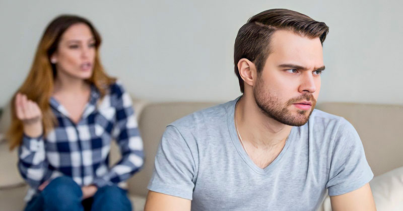 man and woman looking resentful toward each other