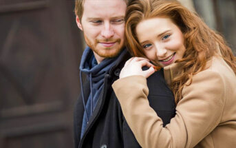 woman embracing man from behind to illustrate showing appreciation