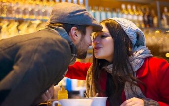 couple kissing in bar - illustrating falling in love too easily