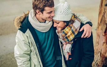 young woman touching man on arm to illustrate having feelings for someone else