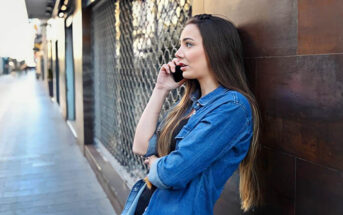 annoyed woman talking on the phone to absent boyfriend who doesn't have time for her