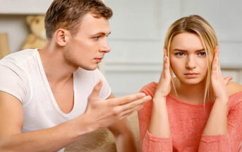 young woman covering her ears from relationship confrontation
