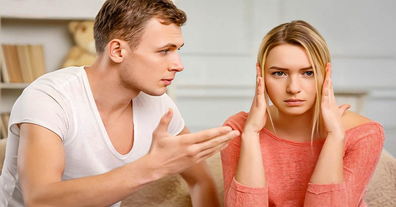 young woman covering her ears from relationship confrontation