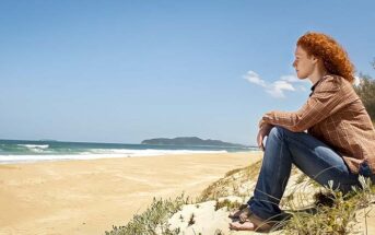 woman looking out across ocean wondering what things to believe in