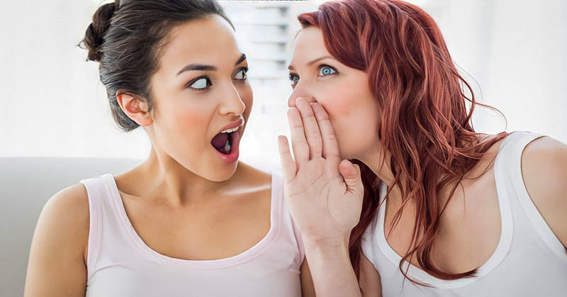 two young women gossiping