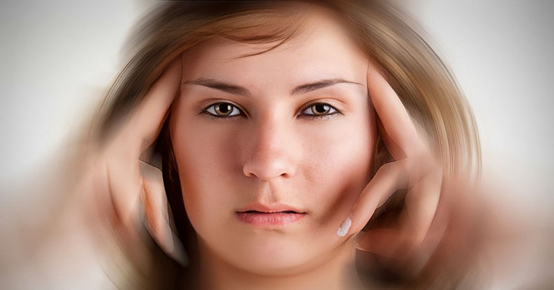 woman with fingers on face with blurred background - illustrating not knowing what to do