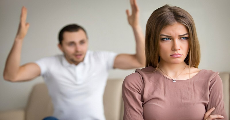man angry at woman waiving his arms in the air - illustrating being treated like a child