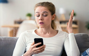 confused woman looking at phone after the guy who ghosted her got back in touch