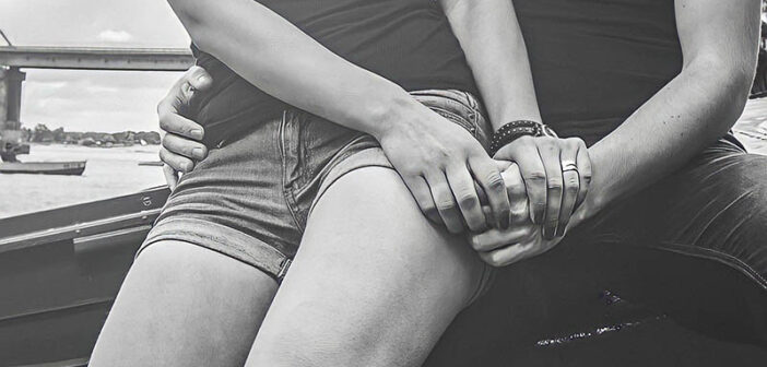 close up black and white photo of couple holding hands