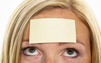 woman with sticky note on her forehead - illustrating labeling people