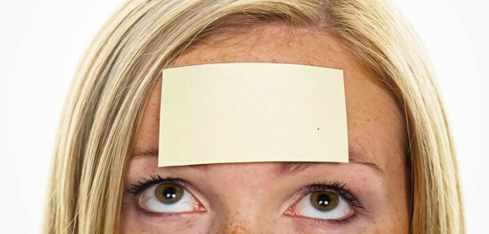 woman with sticky note on her forehead - illustrating labeling people