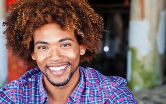 African American man smiling - illustrating the good qualities to look for in a man