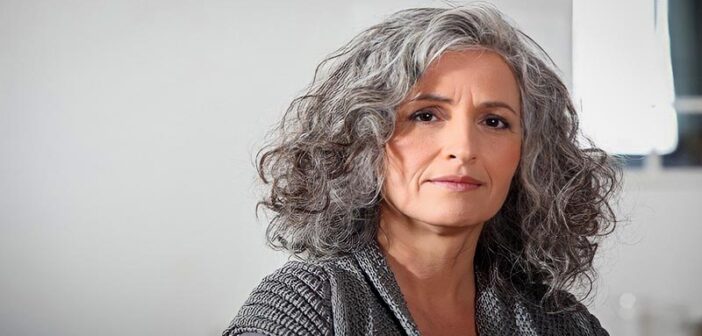 middle aged woman with gray hair illustrating wisdom and intelligence