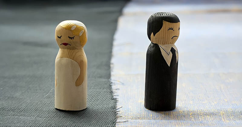 bride and groom figures looking unhappy illustrating it's time to divorce