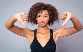 woman with both her thumbs down illustrating complaining about things