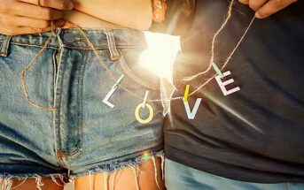 closeup of couple holding string with l-o-v-e letters