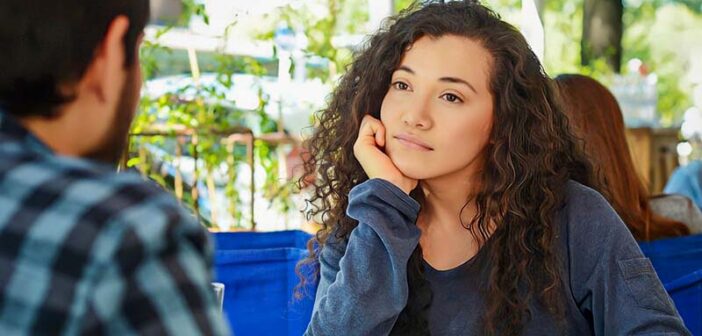 young woman looking at date unsure whether she is attracted to him and whether attraction can grow