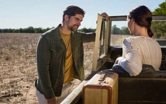 man talking to a woman in an open-topped jeep