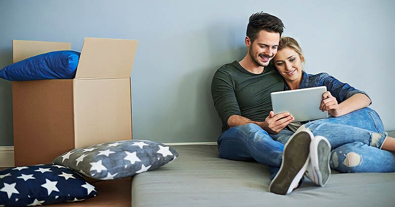 young couple who have just moved in together illustrating cohabitation before marriage