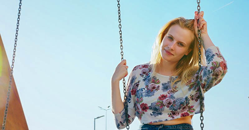 woman on swing because she misses her childhood