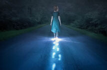 person walking in darkness with glowing footsteps of light - illustrating narcissistic abuse recovery