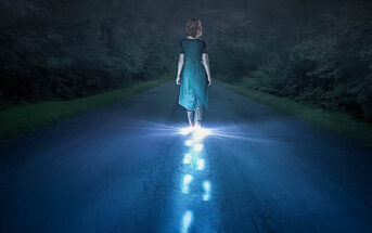 person walking in darkness with glowing footsteps of light - illustrating narcissistic abuse recovery