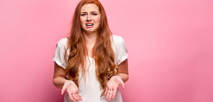 woman looking sad and self-pitying illustrating playing the victim