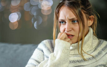 woman biting her nails illustrating that she is scared of dating