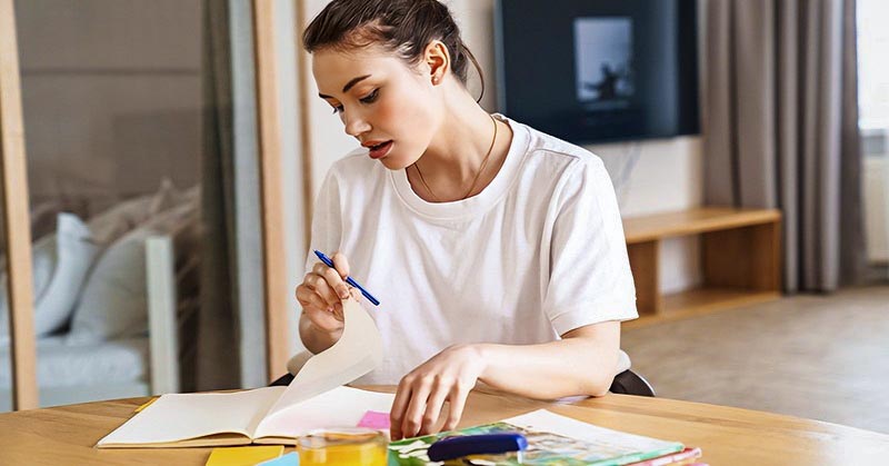 ambitious young woman studying hard