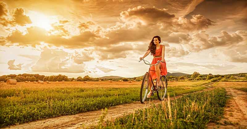 woman riding bike and being independent of her relationship