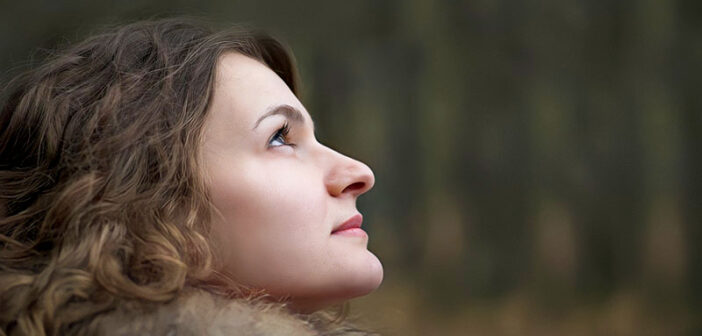 thoughtful young woman looking up - illustrating personal responsibility