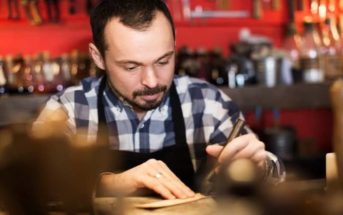 stereotype of a practical person in a workshop using tools