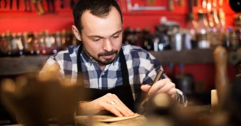 stereotype of a practical person in a workshop using tools