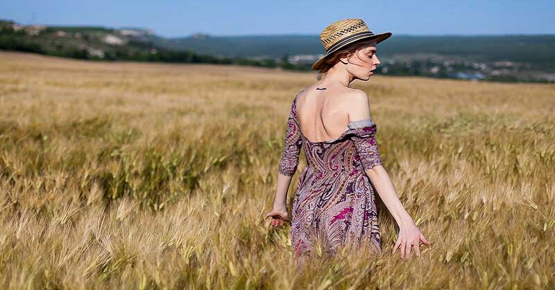 single woman walking through a meadow - illustrating not wanting a relationship